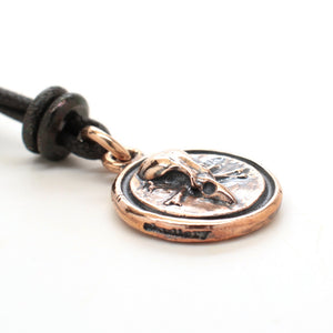bronze skull medallion
