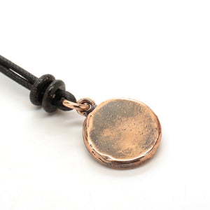 bronze skull medallion
