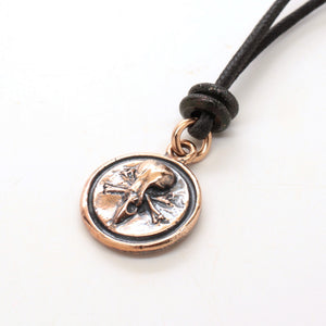 bronze skull medallion