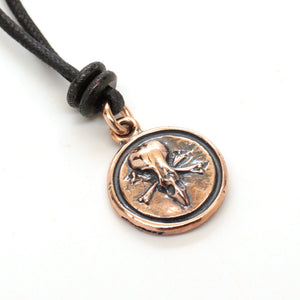 bronze skull medallion