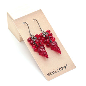 raspberry skull earrings